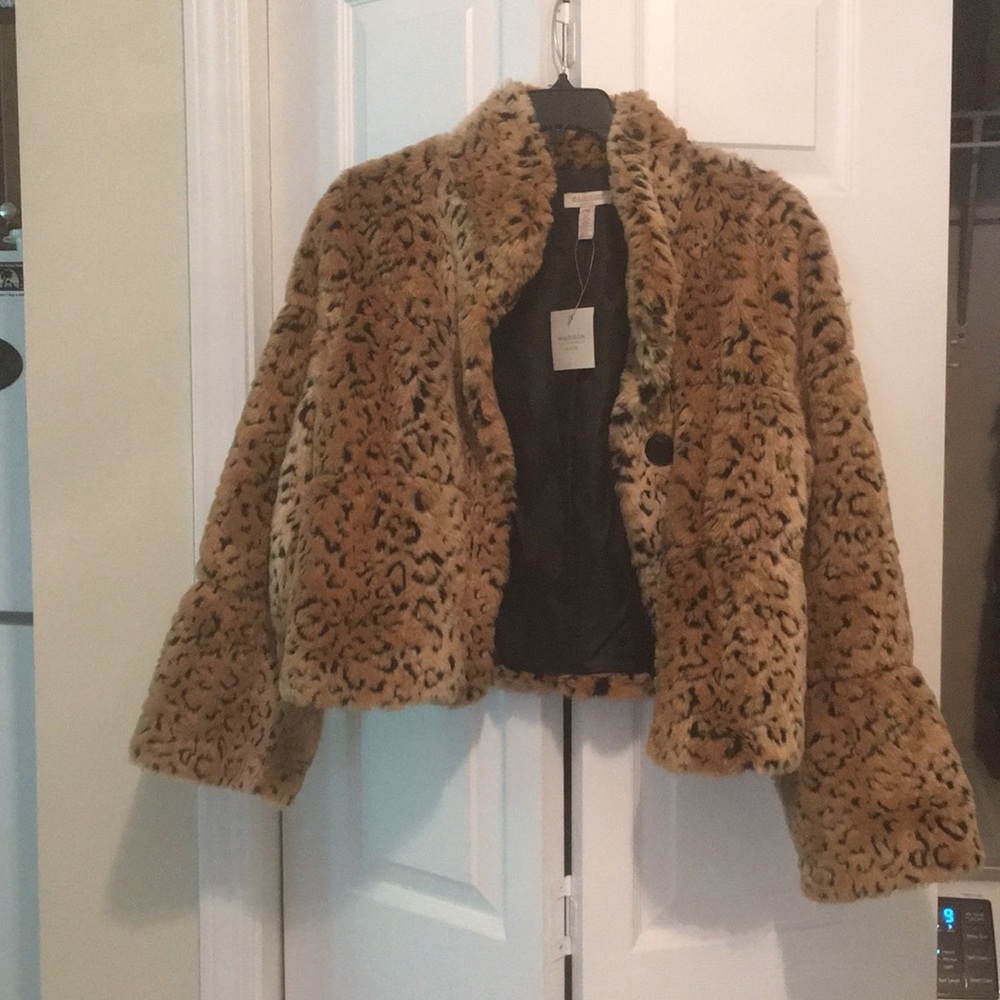 Brand NEW fur coat with tags still attached.